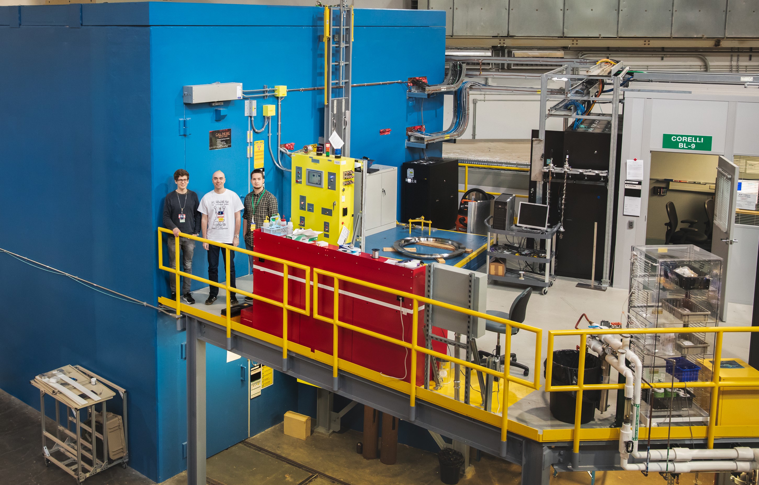 The research team, (left) Kristoffer Holm, Nikolaj Roth, and Emil Klahn, stands next to the CORELLI neutron scattering instrument at ORNL's Spallation Neutron Source. (Credit: ORNL/Genevieve Martin) 