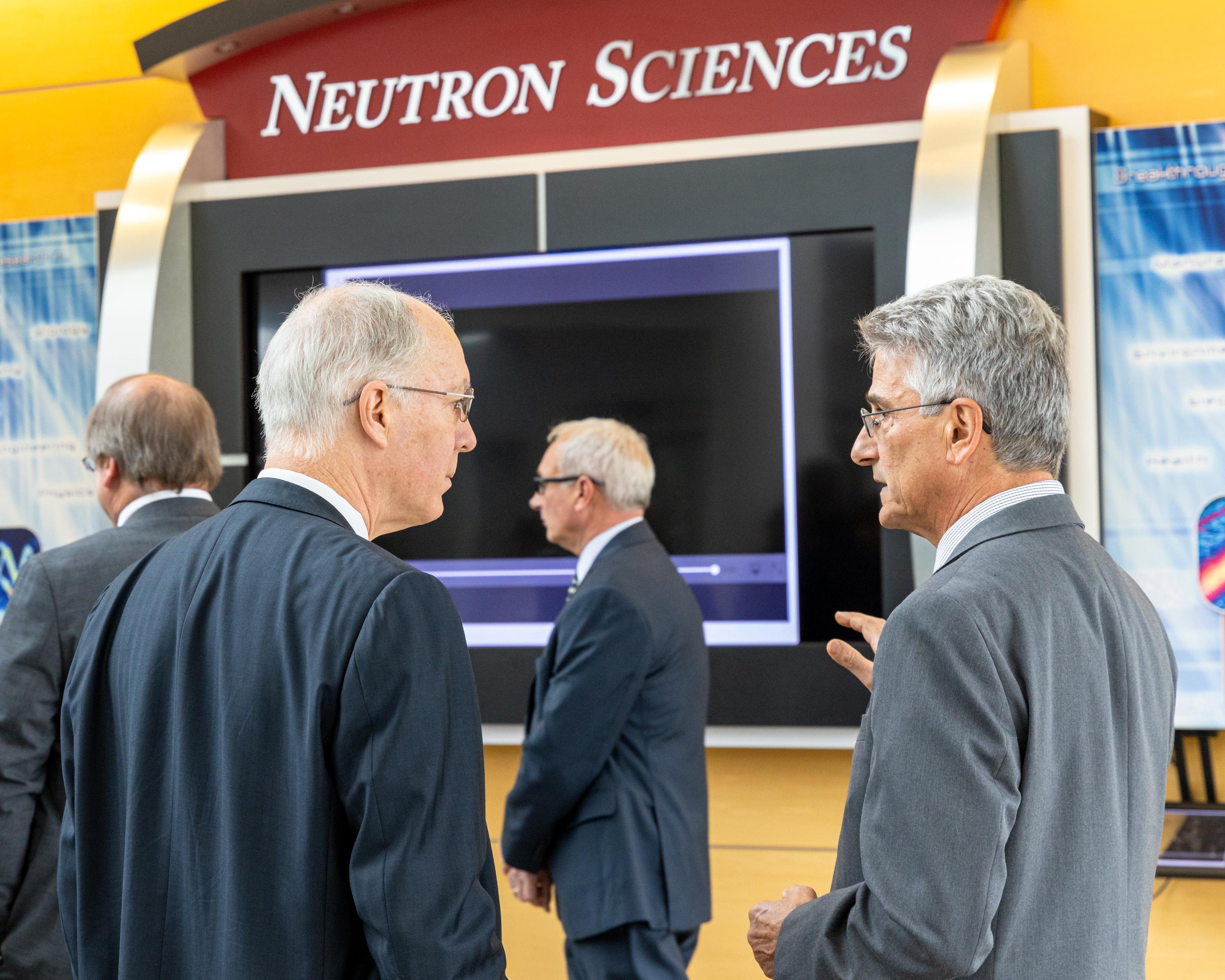 John Galambos (right) talks about neutron science with Illinois Congressman Bill Foster in 2019 at the Spallation Neutron Source.