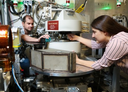 From left, ORNL’s Matthew Frost and Leah Broussard used a neutron scattering instrument at the Spall