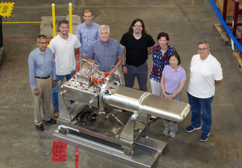 Members of the target design team pose next to the 2.0-MW-capable mercury flow target they developed.