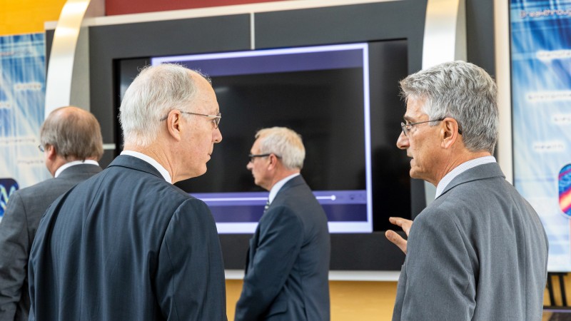 John Galambos (right) talks about neutron science with Illinois Congressman Bill Foster in 2019 at t