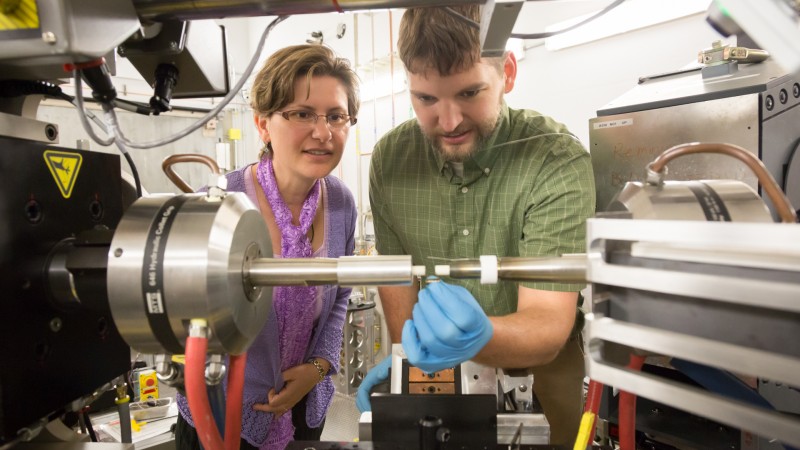 Dr. Elena Garlea, the lead scientist from the Y-12 National Security Complex, and Chris Calhoun, a PhD candidate from the University of Virginia working on the project, prepare a uranium sample for experiments at VULCAN, SNS beam line 7.