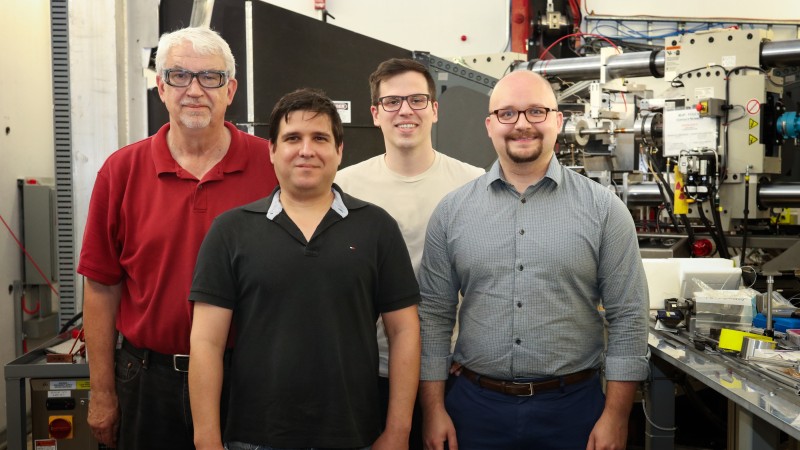 ORNL and Eck Industries R&D staff are using the VULCAN instrument at the Spallation Neutron Source to examine iterations of their cerium-aluminum alloy. The team, David Weiss (left), Orlando Rios, Hunter Henderson, and Zach Sims, are using neutrons to probe the atomic structures to design the alloys with optimal properties to meet industry demands. (Credit: ORNL/Genevieve Martin)