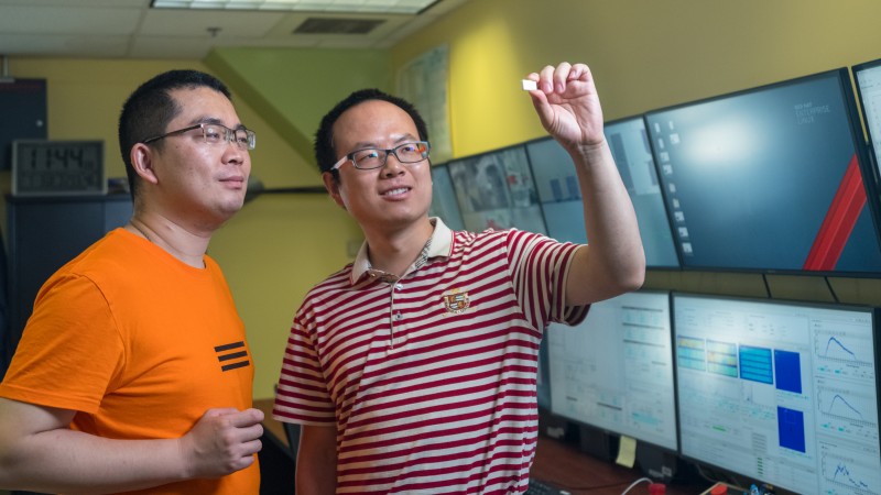 University of Nebraska-Lincoln researchers Xiang Zhang (left) and Prof. Bai Cui use neutron diffraction to study the microstructure and residual stress characterizations of additively manufactured ceramic materials. (Credit: ORNL/Carlos Jones) 