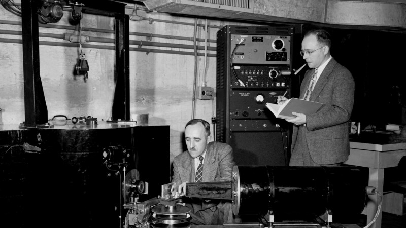Ernest Wollan (left) and Clifford Shull work with a double-crystal neutron spectrometer at the ORNL X-10 Graphite Reactor in 1949.