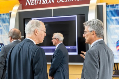 John Galambos (right) talks about neutron science with Illinois Congressman Bill Foster in 2019 at t