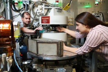 From left, ORNL’s Matthew Frost and Leah Broussard used a neutron scattering instrument at the Spall