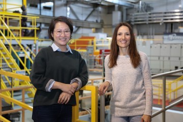 NC State University doctoral student Yue Yuan, left, recently visited the Spallation Neutron Source at Oak Ridge National Laboratory (ORNL) to explore how neutron techniques can improve her work with biocatalytic textiles. Yuan was hosted by Flora Meilleur, an ORNL structural biologist and NC State joint faculty member. Credit: ORNL/Genevieve Martin